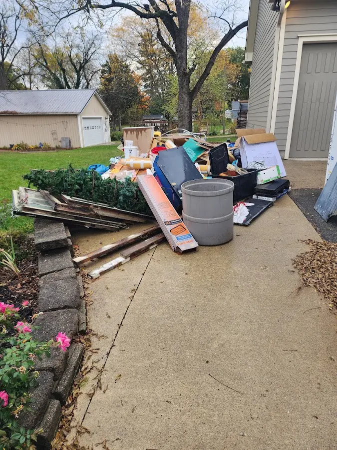 Dumpster being loaded with debris for Commercial Dumpster Rental in Ingram